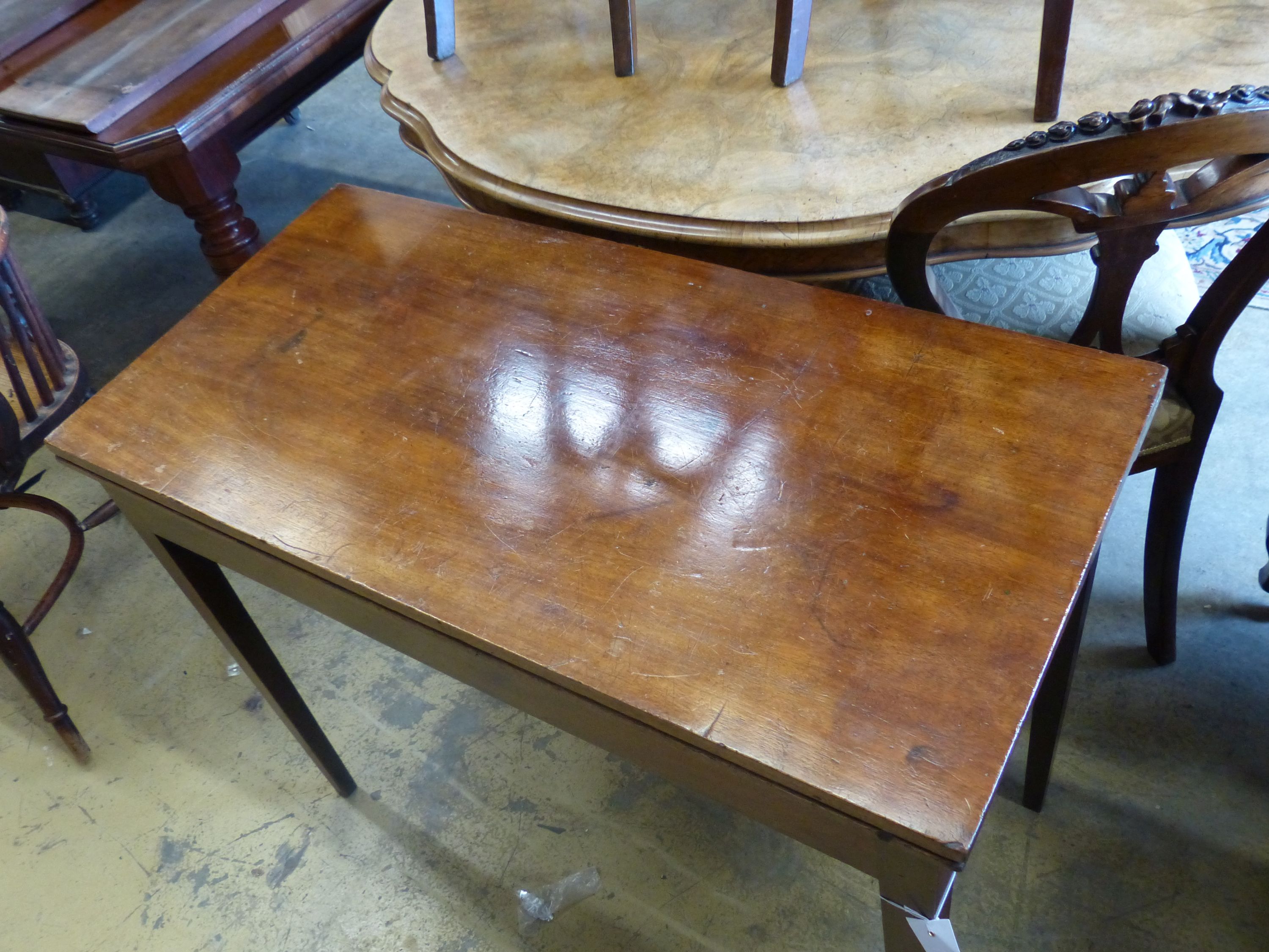 A George III rectangular mahogany folding card table, height 73cm, width 92cm, depth 45cm